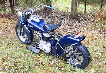 1948 dark blue bobber in autumn leafs